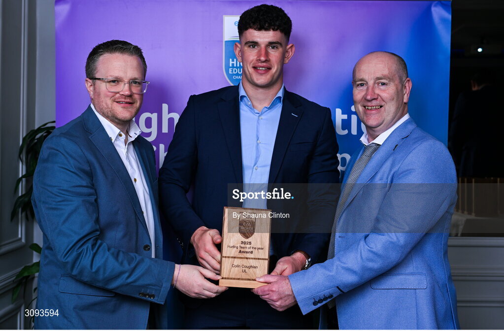 31 March 2025; University of Limerick player Colin Coughlan, centre, is presented with his 2025 Electric Ireland Higher Education GAA Hurling Rising Stars Team of the Year award by Electric Ireland Group Sponsorship & PR Manager Rob Crabbe, left, and Higher Education GAA Chairperson Benny Hurl during the Electric Ireland Higher Education Rising Stars Awards at Castleknock Hotel in Dublin. Photo by Shauna Clinton/Sportsfile