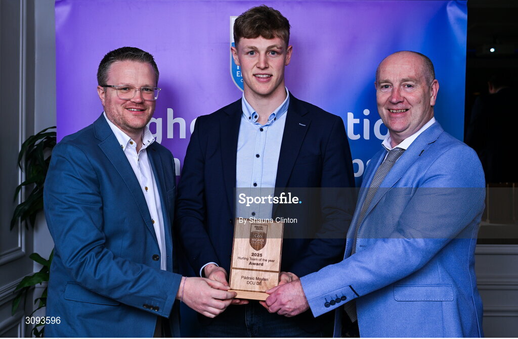 31 March 2025; DCU Dóchas Éireann player Padraic Moylan, centre, is presented with his 2025 Electric Ireland Higher Education GAA Hurling Rising Stars Team of the Year award by Electric Ireland Group Sponsorship & PR Manager Rob Crabbe, left, and Higher Education GAA Chairperson Benny Hurl during the Electric Ireland Higher Education Rising Stars Awards at Castleknock Hotel in Dublin. Photo by Shauna Clinton/Sportsfile