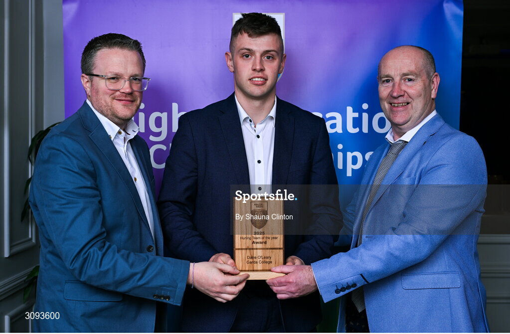31 March 2025; Garda College player Daire O'Leary, centre, is presented with his 2025 Electric Ireland Higher Education GAA Hurling Rising Stars Team of the Year award by Electric Ireland Group Sponsorship & PR Manager Rob Crabbe, left, and Higher Education GAA Chairperson Benny Hurl during the Electric Ireland Higher Education Rising Stars Awards at Castleknock Hotel in Dublin. Photo by Shauna Clinton/Sportsfile
