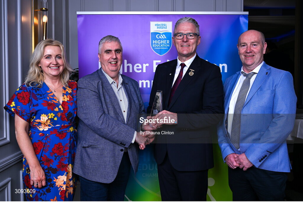 31 March 2025; Higher Education Committee Chairman Gerry Tully, centre, alongside his wife Caroline, is presented with his award by Uachtarán Chumann Lúthchleas Gael Jarlath Burns and Higher Education GAA Chairperson Benny Hurl during the Electric Ireland Higher Education Rising Stars Awards at Castleknock Hotel in Dublin. Photo by Shauna Clinton/Sportsfile
