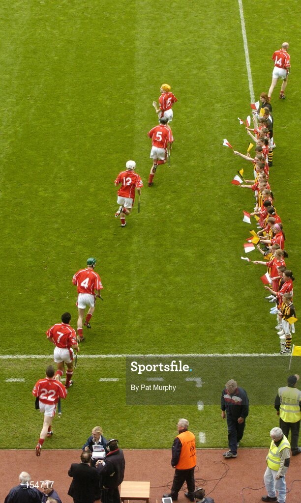 12 September 2004; The Cork players make their way onto the pitch. Guinness All-Ireland Senior Hurling Championship Final, Cork v Kilkenny, Croke Park, Dublin. Picture credit; Pat Murphy / SPORTSFILE *** Local Caption *** Any photograph taken by SPORTSFILE during, or in connection with, the 2004 Guinness All-Ireland Hurling Final which displays GAA logos or contains an image or part of an image of any GAA intellectual property, or, which contains images of a GAA player/players in their playing uniforms, may only be used for editorial and non-advertising purposes.  Use of photographs for advertising, as posters or for purchase separately is strictly prohibited unless prior written approval has been obtained from the Gaelic Athletic Association.
