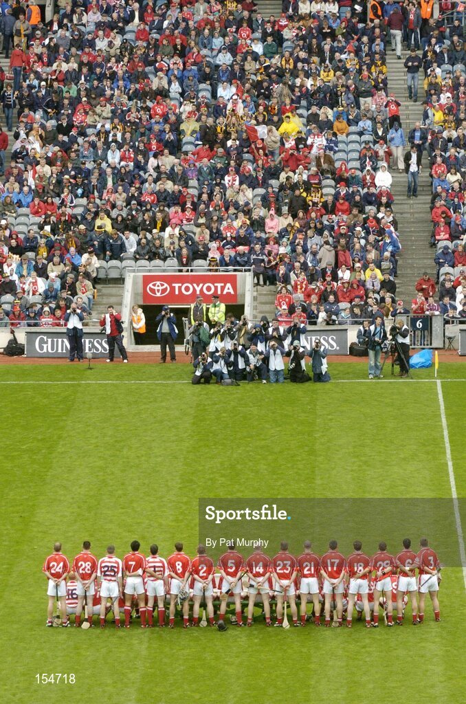 12 September 2004; The Cork team stand for the team photograph. Guinness All-Ireland Senior Hurling Championship Final, Cork v Kilkenny, Croke Park, Dublin. Picture credit; Pat Murphy / SPORTSFILE *** Local Caption *** Any photograph taken by SPORTSFILE during, or in connection with, the 2004 Guinness All-Ireland Hurling Final which displays GAA logos or contains an image or part of an image of any GAA intellectual property, or, which contains images of a GAA player/players in their playing uniforms, may only be used for editorial and non-advertising purposes.  Use of photographs for advertising, as posters or for purchase separately is strictly prohibited unless prior written approval has been obtained from the Gaelic Athletic Association.