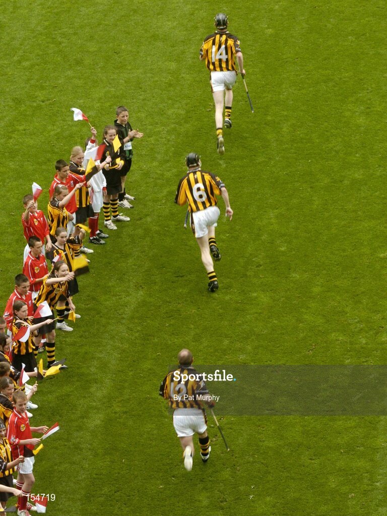 12 September 2004; The Kilkenny players make their way onto the pitch. Guinness All-Ireland Senior Hurling Championship Final, Cork v Kilkenny, Croke Park, Dublin. Picture credit; Pat Murphy / SPORTSFILE *** Local Caption *** Any photograph taken by SPORTSFILE during, or in connection with, the 2004 Guinness All-Ireland Hurling Final which displays GAA logos or contains an image or part of an image of any GAA intellectual property, or, which contains images of a GAA player/players in their playing uniforms, may only be used for editorial and non-advertising purposes.  Use of photographs for advertising, as posters or for purchase separately is strictly prohibited unless prior written approval has been obtained from the Gaelic Athletic Association.
