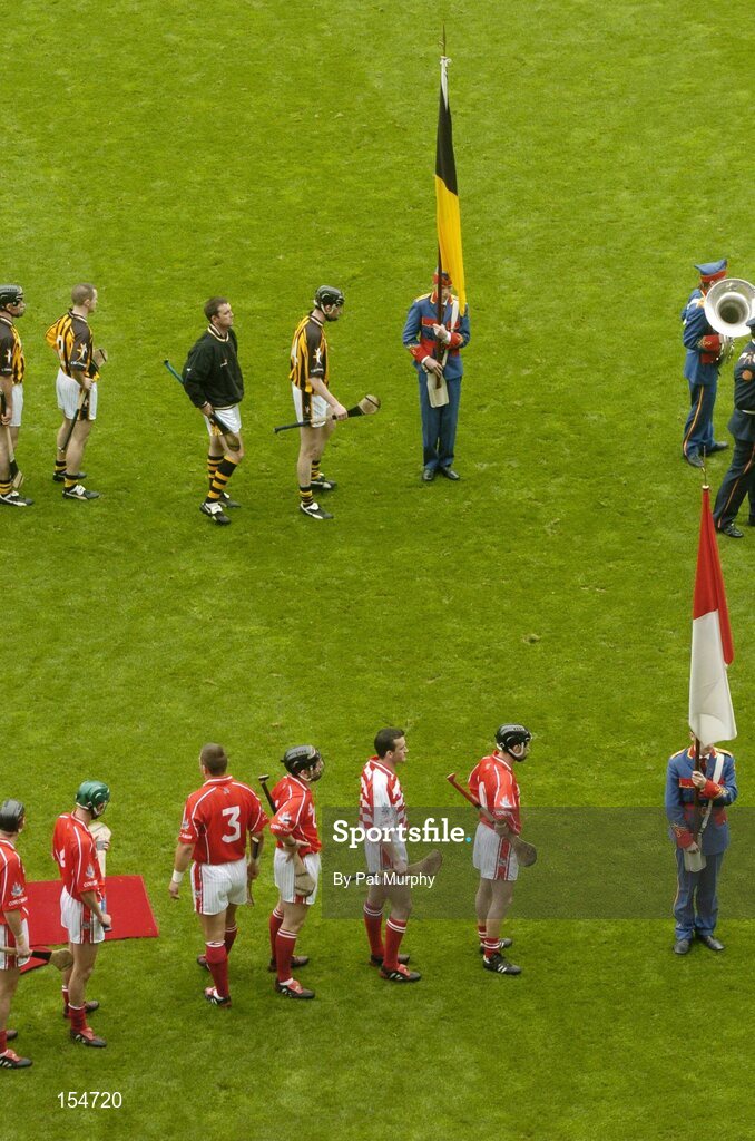 12 September 2004; The Cork and Kilkenny players prepare for the pre-match parade. Guinness All-Ireland Senior Hurling Championship Final, Cork v Kilkenny, Croke Park, Dublin. Picture credit; Pat Murphy / SPORTSFILE *** Local Caption *** Any photograph taken by SPORTSFILE during, or in connection with, the 2004 Guinness All-Ireland Hurling Final which displays GAA logos or contains an image or part of an image of any GAA intellectual property, or, which contains images of a GAA player/players in their playing uniforms, may only be used for editorial and non-advertising purposes.  Use of photographs for advertising, as posters or for purchase separately is strictly prohibited unless prior written approval has been obtained from the Gaelic Athletic Association.