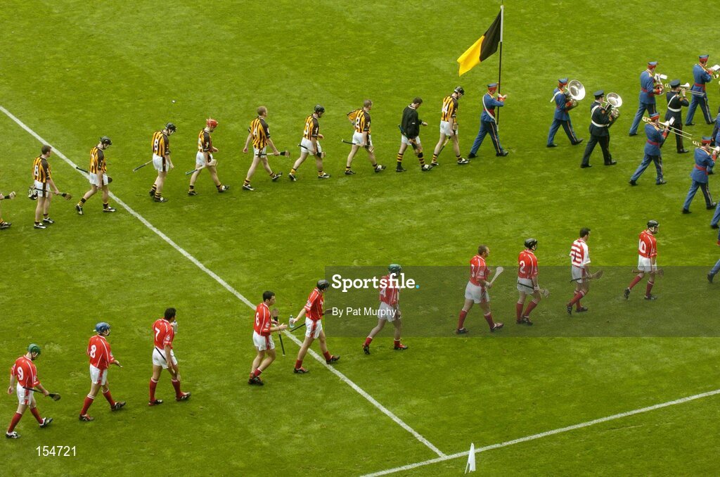 12 September 2004; The Cork and Kilkenny players during the pre-match parade. Guinness All-Ireland Senior Hurling Championship Final, Cork v Kilkenny, Croke Park, Dublin. Picture credit; Pat Murphy / SPORTSFILE *** Local Caption *** Any photograph taken by SPORTSFILE during, or in connection with, the 2004 Guinness All-Ireland Hurling Final which displays GAA logos or contains an image or part of an image of any GAA intellectual property, or, which contains images of a GAA player/players in their playing uniforms, may only be used for editorial and non-advertising purposes.  Use of photographs for advertising, as posters or for purchase separately is strictly prohibited unless prior written approval has been obtained from the Gaelic Athletic Association.