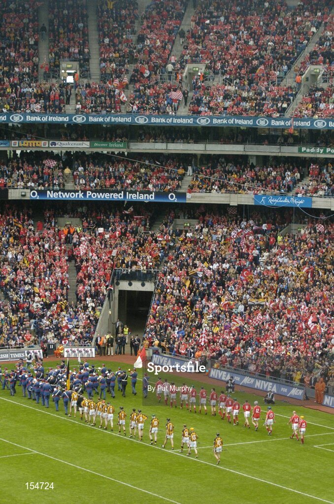 12 September 2004; The Cork and Kilkenny players during the pre-match parade. Guinness All-Ireland Senior Hurling Championship Final, Cork v Kilkenny, Croke Park, Dublin. Picture credit; Pat Murphy / SPORTSFILE *** Local Caption *** Any photograph taken by SPORTSFILE during, or in connection with, the 2004 Guinness All-Ireland Hurling Final which displays GAA logos or contains an image or part of an image of any GAA intellectual property, or, which contains images of a GAA player/players in their playing uniforms, may only be used for editorial and non-advertising purposes.  Use of photographs for advertising, as posters or for purchase separately is strictly prohibited unless prior written approval has been obtained from the Gaelic Athletic Association.