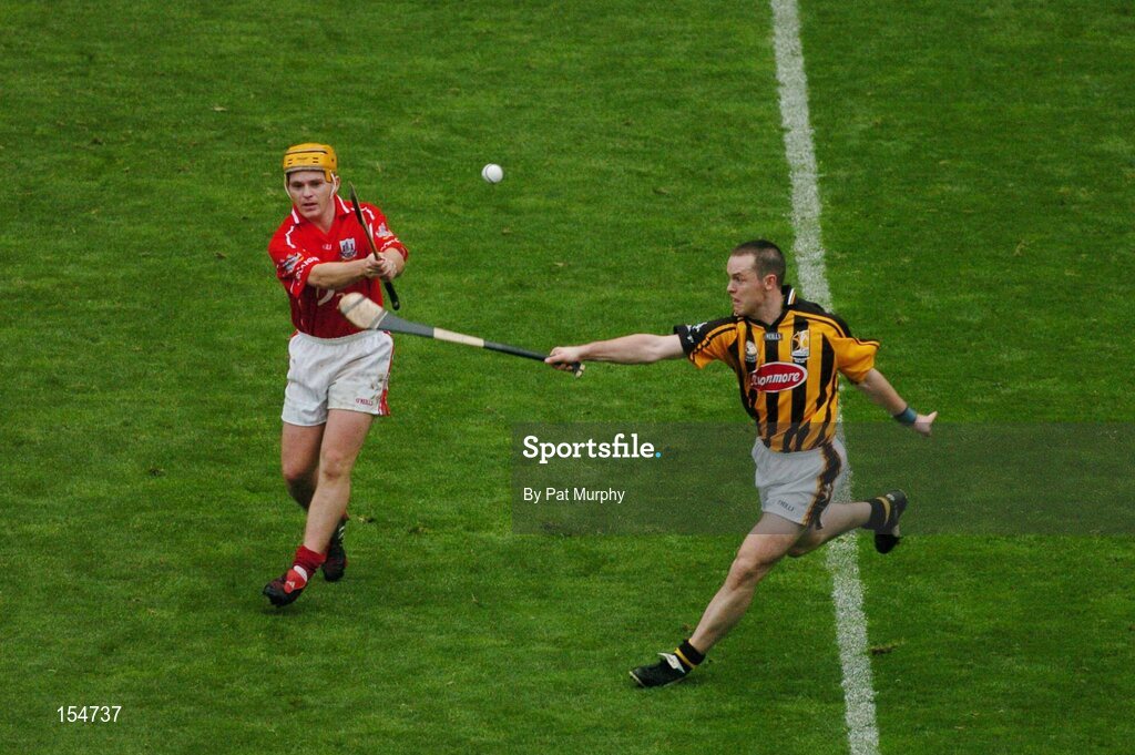 12 September 2004; Joe Deane, Cork, in action against Michael Kavanagh, Kilkenny. Guinness All-Ireland Senior Hurling Championship Final, Cork v Kilkenny, Croke Park, Dublin. Picture credit; Pat Murphy / SPORTSFILE *** Local Caption *** Any photograph taken by SPORTSFILE during, or in connection with, the 2004 Guinness All-Ireland Hurling Final which displays GAA logos or contains an image or part of an image of any GAA intellectual property, or, which contains images of a GAA player/players in their playing uniforms, may only be used for editorial and non-advertising purposes.  Use of photographs for advertising, as posters or for purchase separately is strictly prohibited unless prior written approval has been obtained from the Gaelic Athletic Association.
