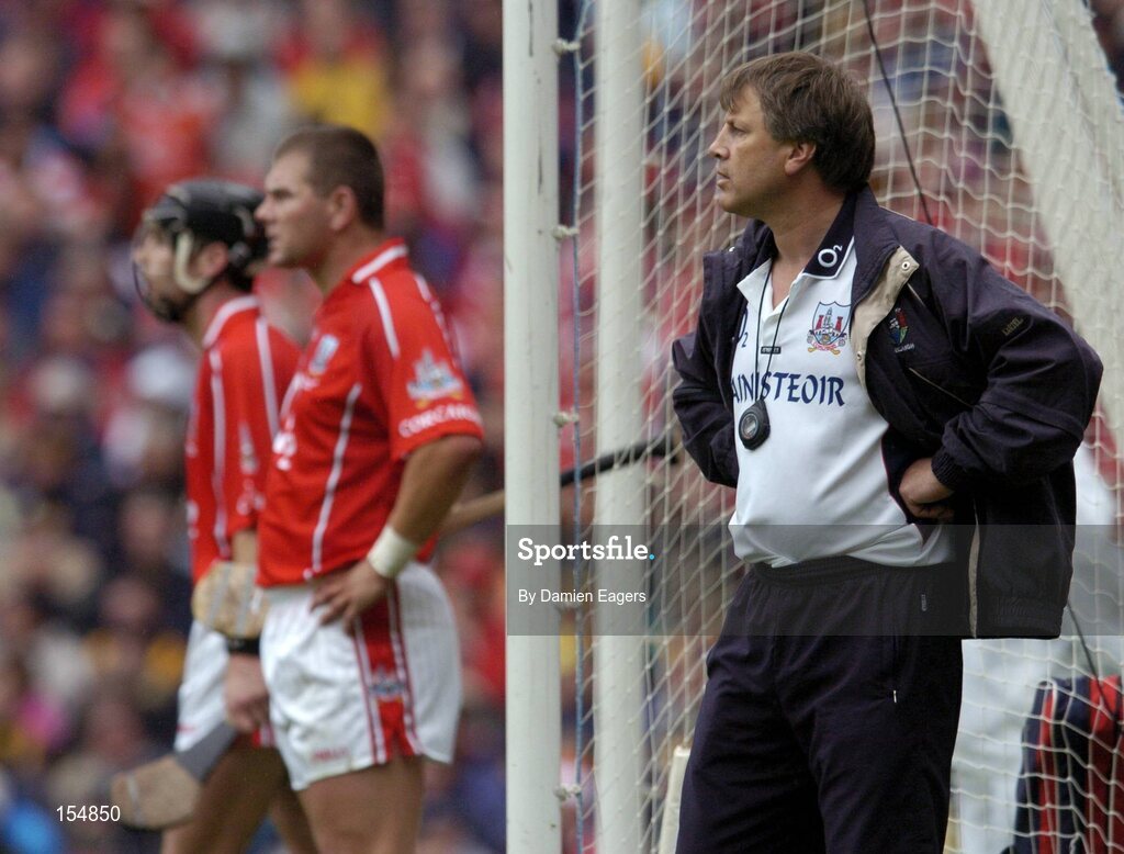 12 September 2004; Cork manager Donal O'Grady follows the match. Guinness All-Ireland Senior Hurling Championship Final, Cork v Kilkenny, Croke Park, Dublin. Picture credit; Damien Eagers / SPORTSFILE *** Local Caption *** Any photograph taken by SPORTSFILE during, or in connection with, the 2004 Guinness All-Ireland Hurling Final which displays GAA logos or contains an image or part of an image of any GAA intellectual property, or, which contains images of a GAA player/players in their playing uniforms, may only be used for editorial and non-advertising purposes.  Use of photographs for advertising, as posters or for purchase separately is strictly prohibited unless prior written approval has been obtained from the Gaelic Athletic Association.