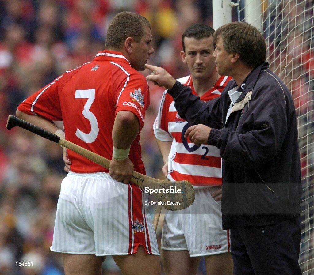 12 September 2004; Cork manager Donal O'Grady issues instructions to Cork goalkeeper Donal Og Cusack and team-mate Diarmuid O'Sullivan. Guinness All-Ireland Senior Hurling Championship Final, Cork v Kilkenny, Croke Park, Dublin. Picture credit; Damien Eagers / SPORTSFILE *** Local Caption *** Any photograph taken by SPORTSFILE during, or in connection with, the 2004 Guinness All-Ireland Hurling Final which displays GAA logos or contains an image or part of an image of any GAA intellectual property, or, which contains images of a GAA player/players in their playing uniforms, may only be used for editorial and non-advertising purposes.  Use of photographs for advertising, as posters or for purchase separately is strictly prohibited unless prior written approval has been obtained from the Gaelic Athletic Association.