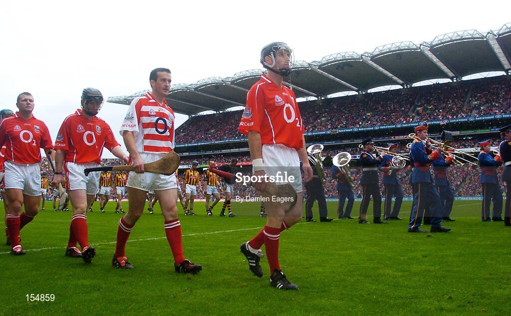 12 September 2004; Cork captain Ben O'Connor leads his team during the pre match parade. Guinness All-Ireland Senior Hurling Championship Final, Cork v Kilkenny, Croke Park, Dublin. Picture credit; Damien Eagers / SPORTSFILE *** Local Caption *** Any photograph taken by SPORTSFILE during, or in connection with, the 2004 Guinness All-Ireland Hurling Final which displays GAA logos or contains an image or part of an image of any GAA intellectual property, or, which contains images of a GAA player/players in their playing uniforms, may only be used for editorial and non-advertising purposes.  Use of photographs for advertising, as posters or for purchase separately is strictly prohibited unless prior written approval has been obtained from the Gaelic Athletic Association.