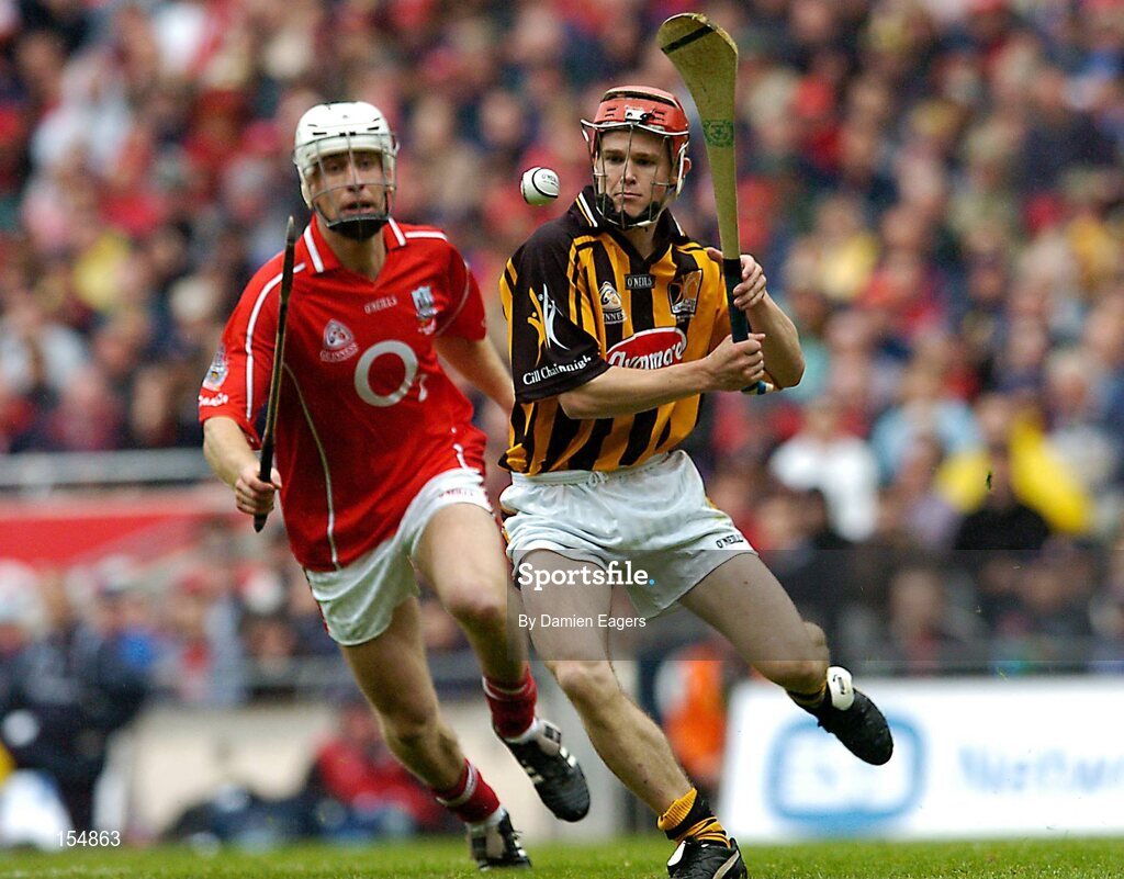 12 September 2004; Tommy Walsh, Kilkenny, in action against Timmy McCarthy, Cork. Guinness All-Ireland Senior Hurling Championship Final, Cork v Kilkenny, Croke Park, Dublin. Picture credit; Damien Eagers / SPORTSFILE *** Local Caption *** Any photograph taken by SPORTSFILE during, or in connection with, the 2004 Guinness All-Ireland Hurling Final which displays GAA logos or contains an image or part of an image of any GAA intellectual property, or, which contains images of a GAA player/players in their playing uniforms, may only be used for editorial and non-advertising purposes.  Use of photographs for advertising, as posters or for purchase separately is strictly prohibited unless prior written approval has been obtained from the Gaelic Athletic Association.