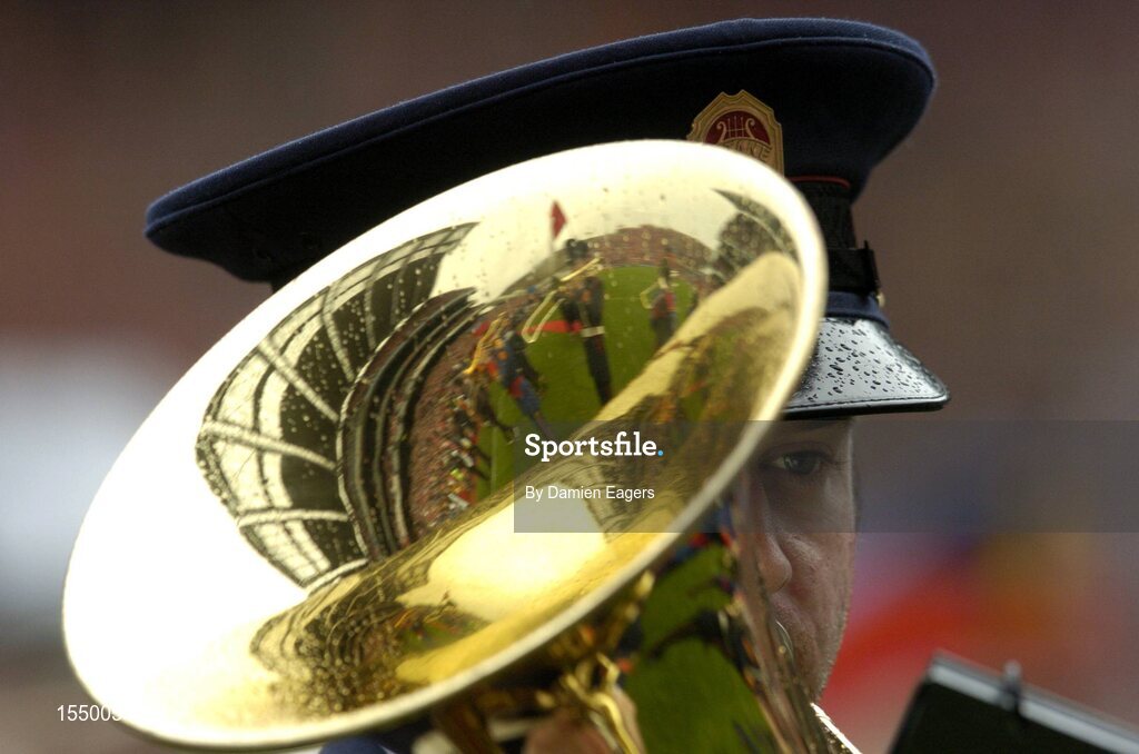 12 September 2004; A member of the Artane boys band and the Artane boys senior band before the match. Guinness All-Ireland Senior Hurling Championship Final, Cork v Kilkenny, Croke Park, Dublin. Picture credit; Damien Eagers / SPORTSFILE *** Local Caption *** Any photograph taken by SPORTSFILE during, or in connection with, the 2004 Guinness All-Ireland Hurling Final which displays GAA logos or contains an image or part of an image of any GAA intellectual property, or, which contains images of a GAA player/players in their playing uniforms, may only be used for editorial and non-advertising purposes.  Use of photographs for advertising, as posters or for purchase separately is strictly prohibited unless prior written approval has been obtained from the Gaelic Athletic Association.