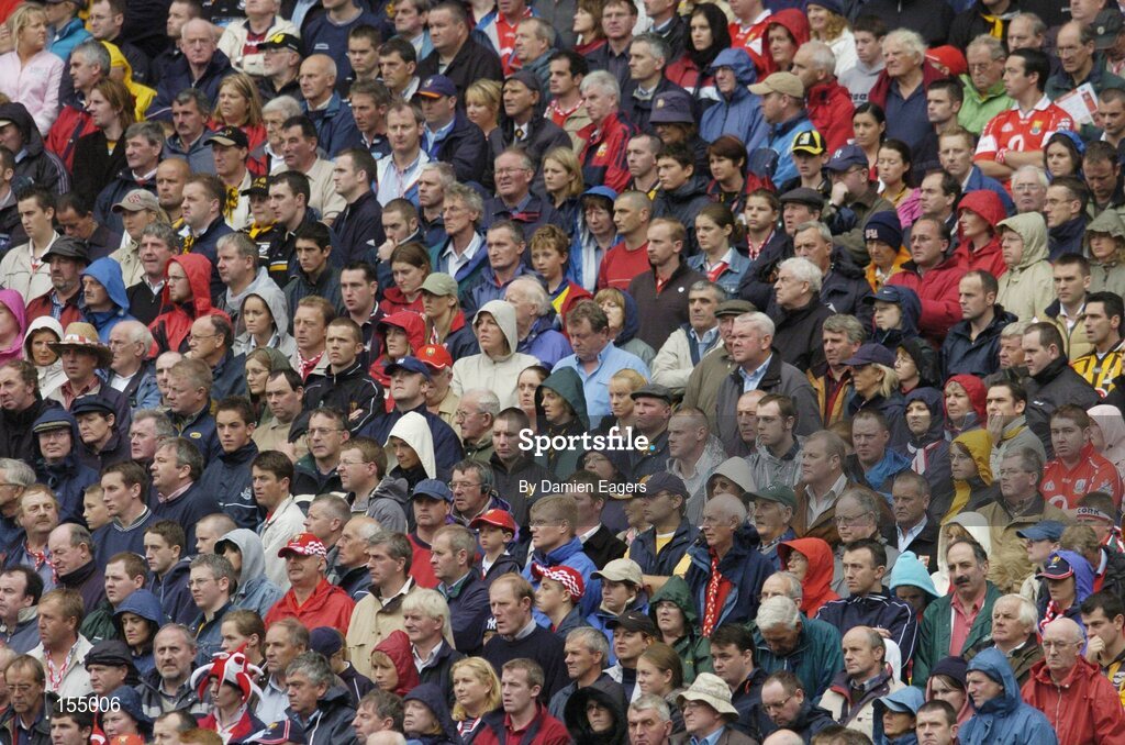 12 September 2004; Cork and Kilkenny supporters stand for a minutes silence in memory of the victims of the Beslan tragedy and Richie Mullally, father of Kilkenny panellists Eddie and Richard who past away Saturday night. Guinness All-Ireland Senior Hurling Championship Final, Cork v Kilkenny, Croke Park, Dublin. Picture credit; Damien Eagers / SPORTSFILE *** Local Caption *** Any photograph taken by SPORTSFILE during, or in connection with, the 2004 Guinness All-Ireland Hurling Final which displays GAA logos or contains an image or part of an image of any GAA intellectual property, or, which contains images of a GAA player/players in their playing uniforms, may only be used for editorial and non-advertising purposes.  Use of photographs for advertising, as posters or for purchase separately is strictly prohibited unless prior written approval has been obtained from the Gaelic Athletic Association.