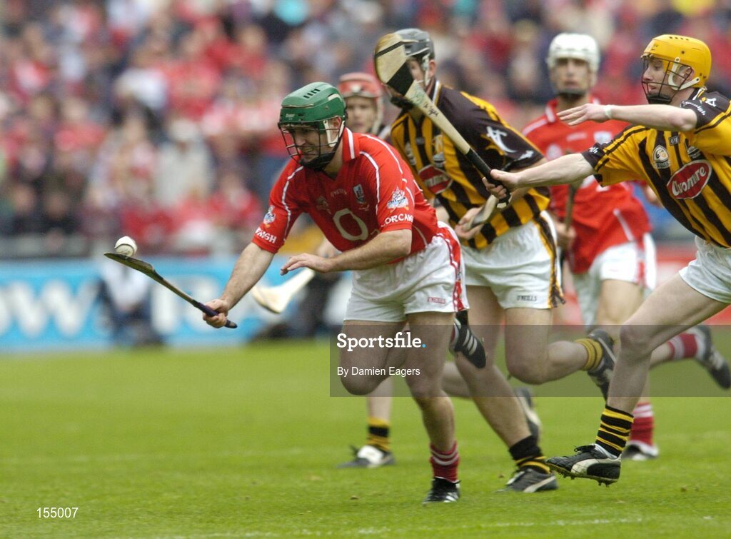 12 September 2004; Jerry O'Connor, Cork, in action against Ken Coogan and James 'Cha' Fitzpatrick, right, Kilkenny. Guinness All-Ireland Senior Hurling Championship Final, Cork v Kilkenny, Croke Park, Dublin. Picture credit; Damien Eagers / SPORTSFILE *** Local Caption *** Any photograph taken by SPORTSFILE during, or in connection with, the 2004 Guinness All-Ireland Hurling Final which displays GAA logos or contains an image or part of an image of any GAA intellectual property, or, which contains images of a GAA player/players in their playing uniforms, may only be used for editorial and non-advertising purposes.  Use of photographs for advertising, as posters or for purchase separately is strictly prohibited unless prior written approval has been obtained from the Gaelic Athletic Association.