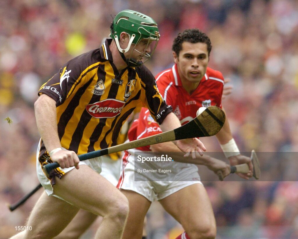 12 September 2004; Henry Shefflin, Kilkenny, in action against Sean Og O'hAilpin, Cork. Guinness All-Ireland Senior Hurling Championship Final, Cork v Kilkenny, Croke Park, Dublin. Picture credit; Damien Eagers / SPORTSFILE *** Local Caption *** Any photograph taken by SPORTSFILE during, or in connection with, the 2004 Guinness All-Ireland Hurling Final which displays GAA logos or contains an image or part of an image of any GAA intellectual property, or, which contains images of a GAA player/players in their playing uniforms, may only be used for editorial and non-advertising purposes.  Use of photographs for advertising, as posters or for purchase separately is strictly prohibited unless prior written approval has been obtained from the Gaelic Athletic Association.