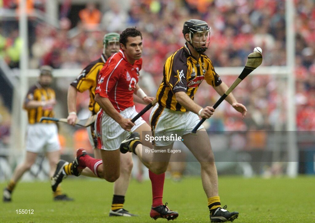 12 September 2004; Ken Coogan, Kilkenny, in action against Sean Og O'hAilpin, Cork. Guinness All-Ireland Senior Hurling Championship Final, Cork v Kilkenny, Croke Park, Dublin. Picture credit; Damien Eagers / SPORTSFILE *** Local Caption *** Any photograph taken by SPORTSFILE during, or in connection with, the 2004 Guinness All-Ireland Hurling Final which displays GAA logos or contains an image or part of an image of any GAA intellectual property, or, which contains images of a GAA player/players in their playing uniforms, may only be used for editorial and non-advertising purposes.  Use of photographs for advertising, as posters or for purchase separately is strictly prohibited unless prior written approval has been obtained from the Gaelic Athletic Association.