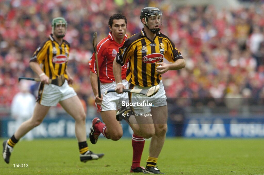 12 September 2004; Ken Coogan, Kilkenny, in action against Sean Og O'hAilpin, Cork. Guinness All-Ireland Senior Hurling Championship Final, Cork v Kilkenny, Croke Park, Dublin. Picture credit; Damien Eagers / SPORTSFILE *** Local Caption *** Any photograph taken by SPORTSFILE during, or in connection with, the 2004 Guinness All-Ireland Hurling Final which displays GAA logos or contains an image or part of an image of any GAA intellectual property, or, which contains images of a GAA player/players in their playing uniforms, may only be used for editorial and non-advertising purposes.  Use of photographs for advertising, as posters or for purchase separately is strictly prohibited unless prior written approval has been obtained from the Gaelic Athletic Association.