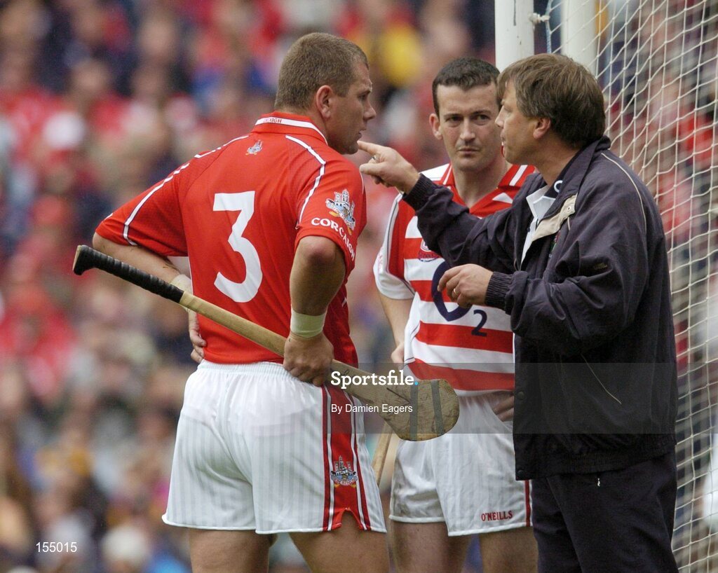 12 September 2004; Cork manager Donal O'Grady issues instructions to Cork goalkeeper Donal Og Cusack and team-mate Diarmuid O'Sullivan. Guinness All-Ireland Senior Hurling Championship Final, Cork v Kilkenny, Croke Park, Dublin. Picture credit; Damien Eagers / SPORTSFILE *** Local Caption *** Any photograph taken by SPORTSFILE during, or in connection with, the 2004 Guinness All-Ireland Hurling Final which displays GAA logos or contains an image or part of an image of any GAA intellectual property, or, which contains images of a GAA player/players in their playing uniforms, may only be used for editorial and non-advertising purposes.  Use of photographs for advertising, as posters or for purchase separately is strictly prohibited unless prior written approval has been obtained from the Gaelic Athletic Association.