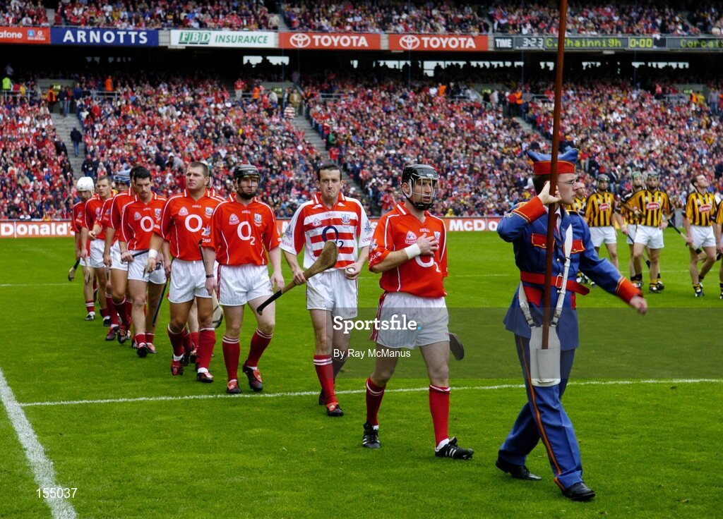 12 September 2004; The Cork team led by Ben O'Connor during the pre-match parade. Guinness All-Ireland Senior Hurling Championship Final, Cork v Kilkenny, Croke Park, Dublin. Picture credit; Ray McManus / SPORTSFILE *** Local Caption *** Any photograph taken by SPORTSFILE during, or in connection with, the 2004 Guinness All-Ireland Hurling Final which displays GAA logos or contains an image or part of an image of any GAA intellectual property, or, which contains images of a GAA player/players in their playing uniforms, may only be used for editorial and non-advertising purposes.  Use of photographs for advertising, as posters or for purchase separately is strictly prohibited unless prior written approval has been obtained from the Gaelic Athletic Association.