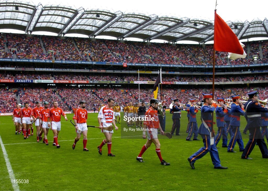 12 September 2004; The Cork and Kilkenny teams during the pre-match parade. Guinness All-Ireland Senior Hurling Championship Final, Cork v Kilkenny, Croke Park, Dublin. Picture credit; Ray McManus / SPORTSFILE *** Local Caption *** Any photograph taken by SPORTSFILE during, or in connection with, the 2004 Guinness All-Ireland Hurling Final which displays GAA logos or contains an image or part of an image of any GAA intellectual property, or, which contains images of a GAA player/players in their playing uniforms, may only be used for editorial and non-advertising purposes.  Use of photographs for advertising, as posters or for purchase separately is strictly prohibited unless prior written approval has been obtained from the Gaelic Athletic Association.