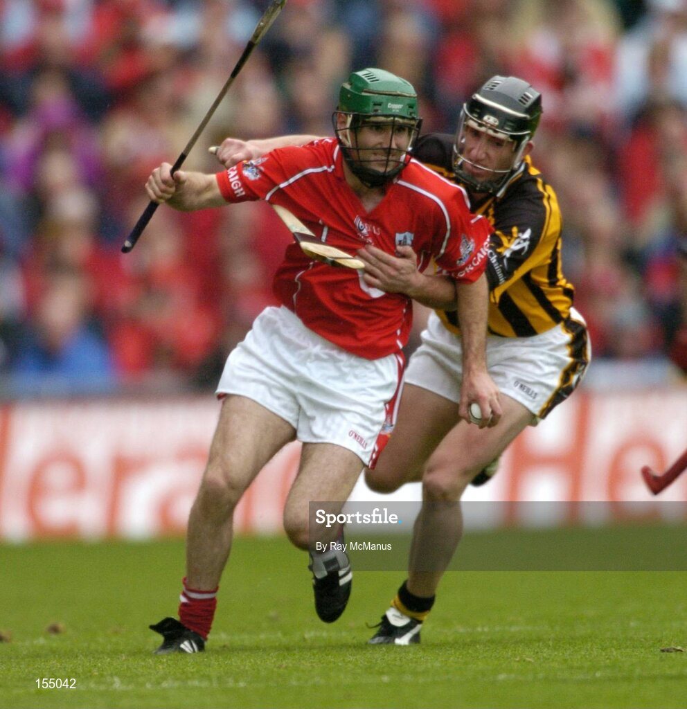 12 September 2004; Jerry O'Connor, Cork, in action against Derek Lyng, Kilkenny. Guinness All-Ireland Senior Hurling Championship Final, Cork v Kilkenny, Croke Park, Dublin. Picture credit; Ray McManus / SPORTSFILE *** Local Caption *** Any photograph taken by SPORTSFILE during, or in connection with, the 2004 Guinness All-Ireland Hurling Final which displays GAA logos or contains an image or part of an image of any GAA intellectual property, or, which contains images of a GAA player/players in their playing uniforms, may only be used for editorial and non-advertising purposes.  Use of photographs for advertising, as posters or for purchase separately is strictly prohibited unless prior written approval has been obtained from the Gaelic Athletic Association.