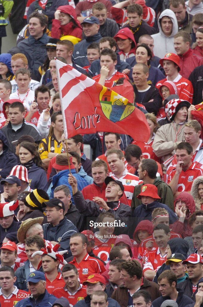 12 September 2004; Cork fans cheer on their side during the game. Guinness All-Ireland Senior Hurling Championship Final, Cork v Kilkenny, Croke Park, Dublin. Picture credit; Ray McManus / SPORTSFILE *** Local Caption *** Any photograph taken by SPORTSFILE during, or in connection with, the 2004 Guinness All-Ireland Hurling Final which displays GAA logos or contains an image or part of an image of any GAA intellectual property, or, which contains images of a GAA player/players in their playing uniforms, may only be used for editorial and non-advertising purposes.  Use of photographs for advertising, as posters or for purchase separately is strictly prohibited unless prior written approval has been obtained from the Gaelic Athletic Association.