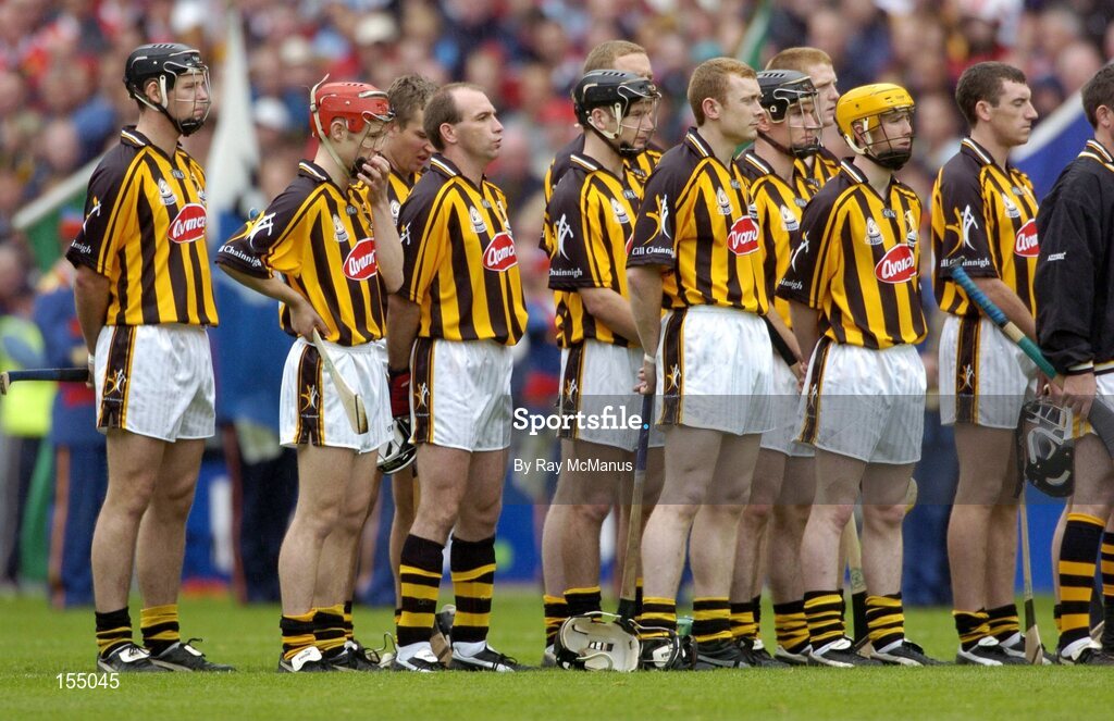 12 September 2004; The Kilkenny team stand for the National Anthem. Guinness All-Ireland Senior Hurling Championship Final, Cork v Kilkenny, Croke Park, Dublin. Picture credit; Ray McManus / SPORTSFILE *** Local Caption *** Any photograph taken by SPORTSFILE during, or in connection with, the 2004 Guinness All-Ireland Hurling Final which displays GAA logos or contains an image or part of an image of any GAA intellectual property, or, which contains images of a GAA player/players in their playing uniforms, may only be used for editorial and non-advertising purposes.  Use of photographs for advertising, as posters or for purchase separately is strictly prohibited unless prior written approval has been obtained from the Gaelic Athletic Association.