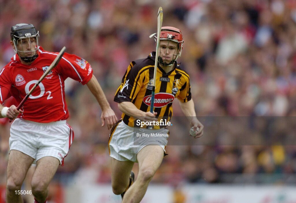12 September 2004; Tommy Walsh, Kilkenny, in action against Ben O'Connor, Cork. Guinness All-Ireland Senior Hurling Championship Final, Cork v Kilkenny, Croke Park, Dublin. Picture credit; Ray McManus / SPORTSFILE *** Local Caption *** Any photograph taken by SPORTSFILE during, or in connection with, the 2004 Guinness All-Ireland Hurling Final which displays GAA logos or contains an image or part of an image of any GAA intellectual property, or, which contains images of a GAA player/players in their playing uniforms, may only be used for editorial and non-advertising purposes.  Use of photographs for advertising, as posters or for purchase separately is strictly prohibited unless prior written approval has been obtained from the Gaelic Athletic Association.