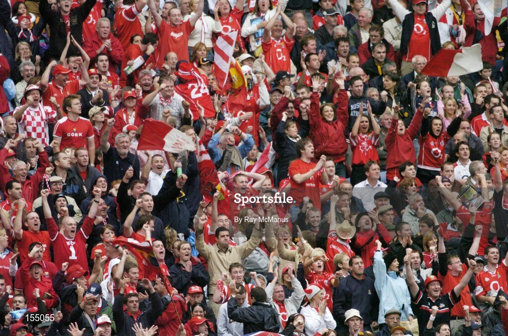 12 September 2004; Cork fans cheer on their side during the game. Guinness All-Ireland Senior Hurling Championship Final, Cork v Kilkenny, Croke Park, Dublin. Picture credit; Ray McManus / SPORTSFILE *** Local Caption *** Any photograph taken by SPORTSFILE during, or in connection with, the 2004 Guinness All-Ireland Hurling Final which displays GAA logos or contains an image or part of an image of any GAA intellectual property, or, which contains images of a GAA player/players in their playing uniforms, may only be used for editorial and non-advertising purposes.  Use of photographs for advertising, as posters or for purchase separately is strictly prohibited unless prior written approval has been obtained from the Gaelic Athletic Association.