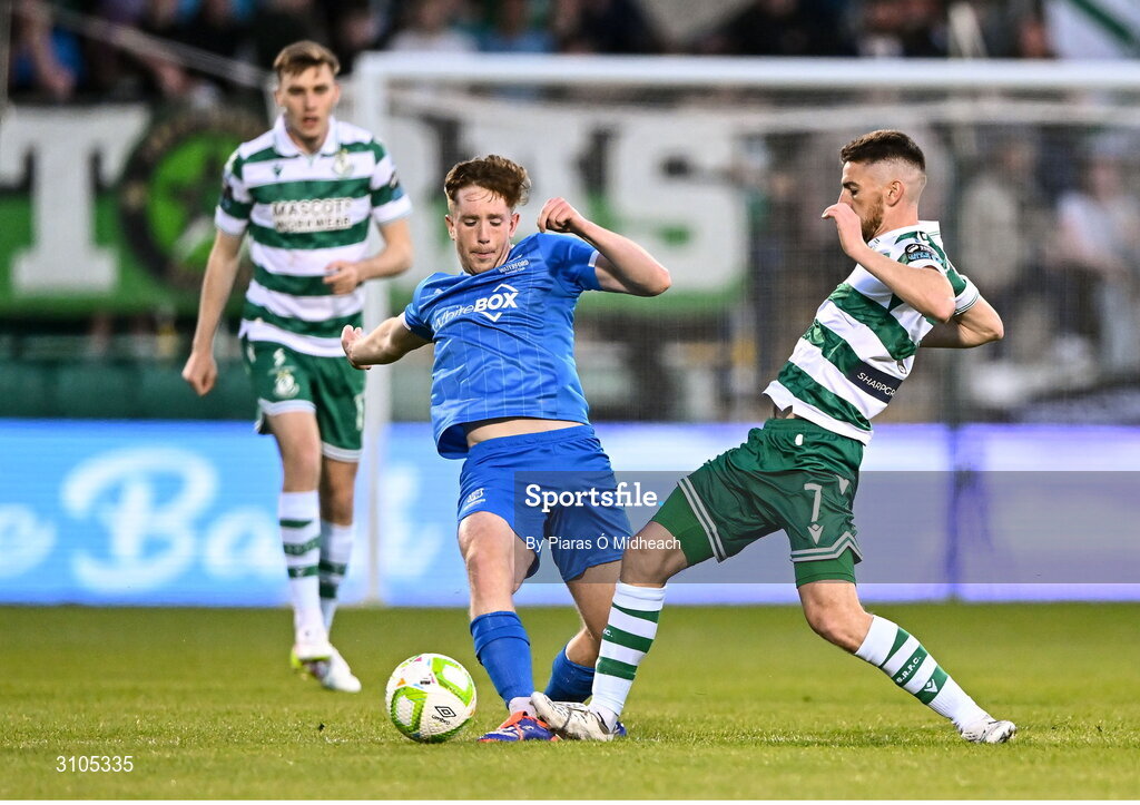 11 April 2025; Sam Glenfield of Waterford in action against Dylan Watts of Shamrock Rovers during the SSE Airtricity Men's Premier Division match between Shamrock Rovers and Waterford at Tallaght Stadium in Dublin. Photo by Piaras Ó Mídheach/Sportsfile