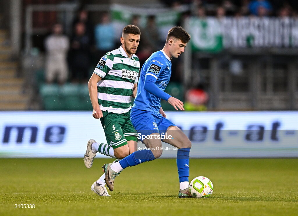 11 April 2025; Ben McCormack of Waterford in action against Dylan Watts of Shamrock Rovers during the SSE Airtricity Men's Premier Division match between Shamrock Rovers and Waterford at Tallaght Stadium in Dublin. Photo by Piaras Ó Mídheach/Sportsfile