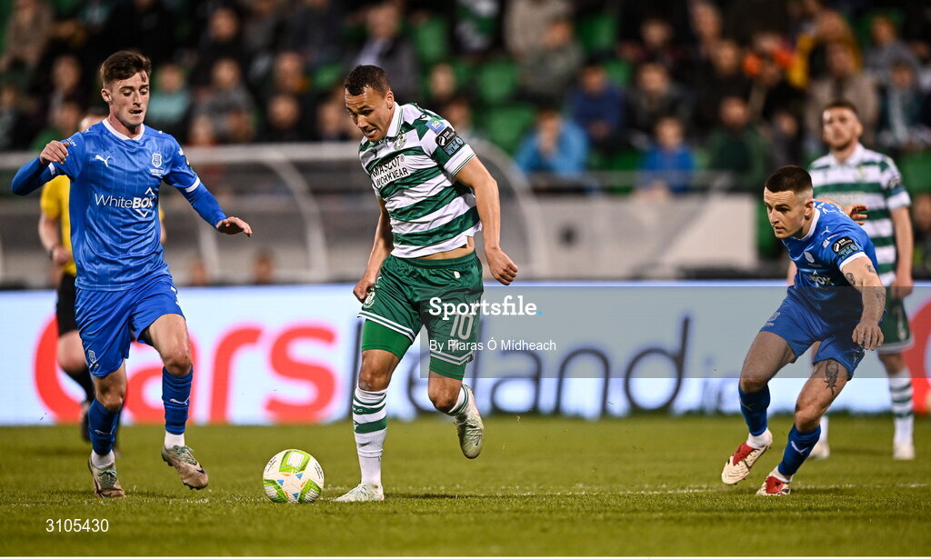 11 April 2025; Graham Burke of Shamrock Rovers in action against Waterford players Ben McCormack, left, and Darragh Leahy of Waterford during the SSE Airtricity Men's Premier Division match between Shamrock Rovers and Waterford at Tallaght Stadium in Dublin. Photo by Piaras Ó Mídheach/Sportsfile