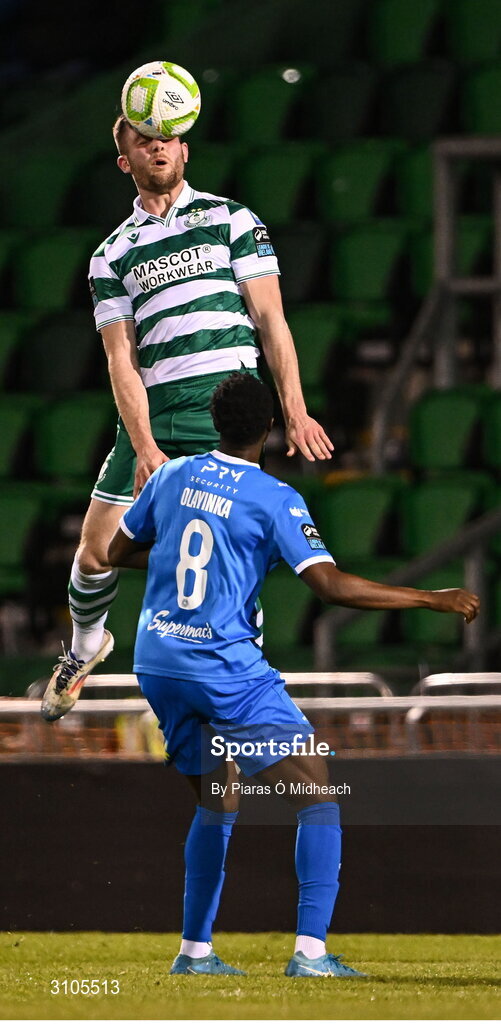 11 April 2025; Josh Honohan of Shamrock Rovers in action against James Olayinka of Waterford during the SSE Airtricity Men's Premier Division match between Shamrock Rovers and Waterford at Tallaght Stadium in Dublin. Photo by Piaras Ó Mídheach/Sportsfile