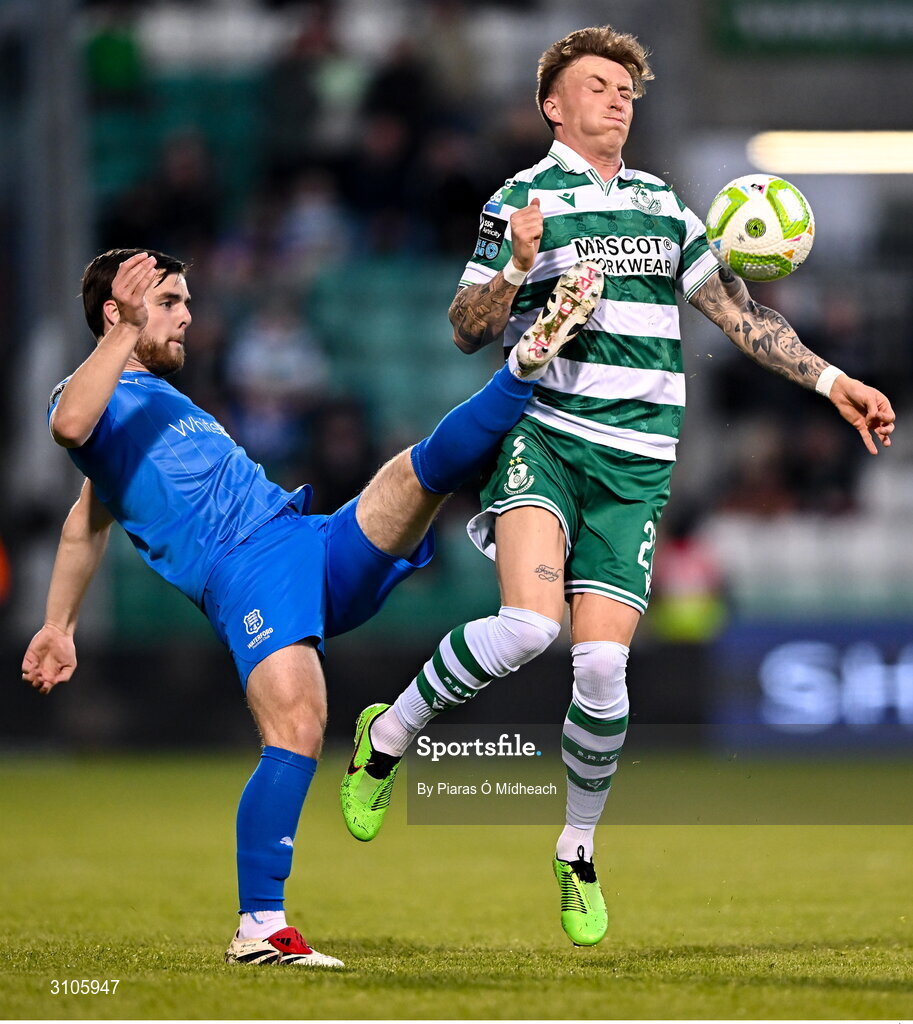 11 April 2025; Danny Grant of Shamrock Rovers in action against Ryan Burke of Waterford during the SSE Airtricity Men's Premier Division match between Shamrock Rovers and Waterford at Tallaght Stadium in Dublin. Photo by Piaras Ó Mídheach/Sportsfile