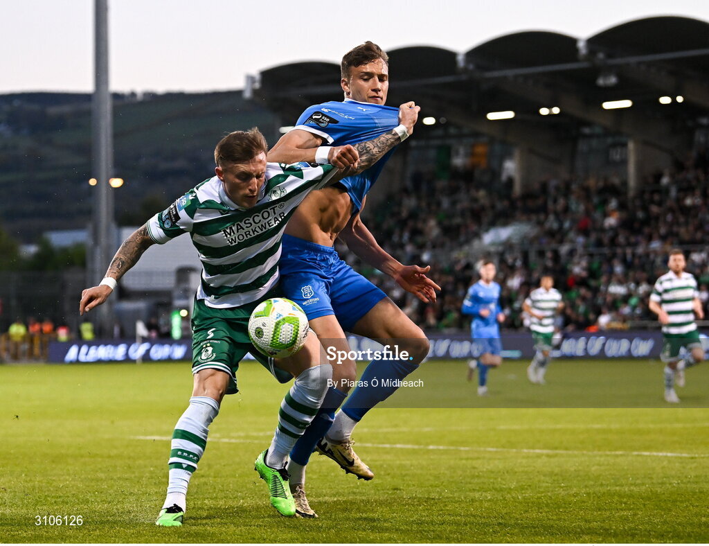 11 April 2025; Danny Grant of Shamrock Rovers in action against Kacper Radkowski of Waterford during the SSE Airtricity Men's Premier Division match between Shamrock Rovers and Waterford at Tallaght Stadium in Dublin. Photo by Piaras Ó Mídheach/Sportsfile
