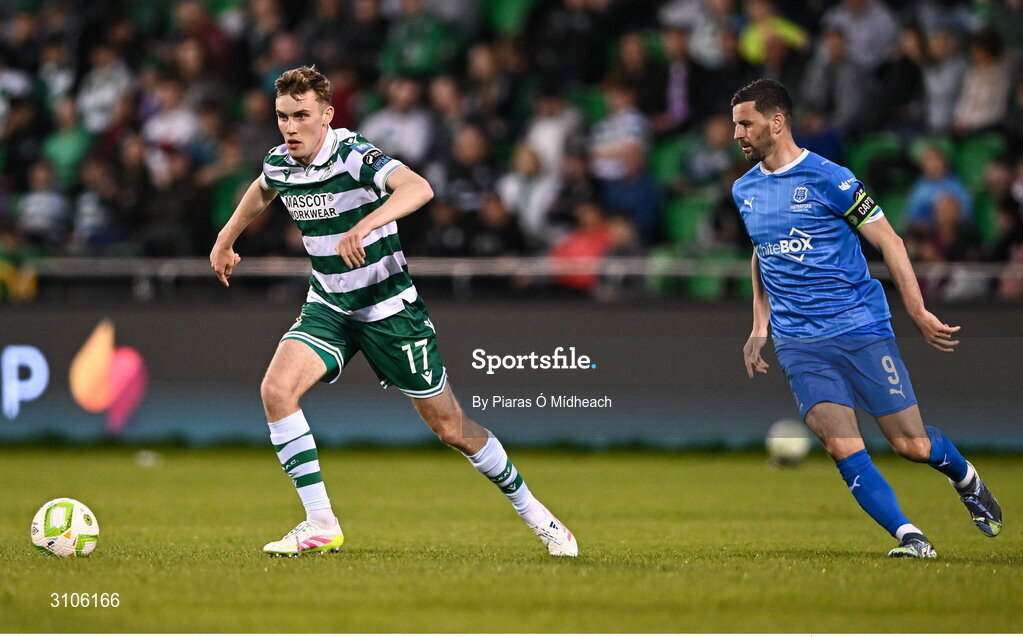 11 April 2025; Matt Healy of Shamrock Rovers in action against Padraig Amond of Waterford during the SSE Airtricity Men's Premier Division match between Shamrock Rovers and Waterford at Tallaght Stadium in Dublin. Photo by Piaras Ó Mídheach/Sportsfile