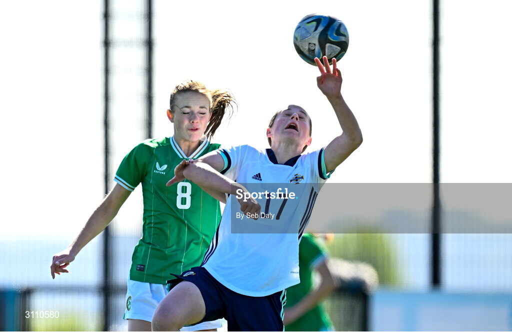 17 April 2025; Ruby Norris of Republic of Ireland in action against Grace Murray of Northern Ireland during the Girls U15 SAFIB Bob Docherty Cup match between Northern Ireland and Republic of Ireland at Greenisland FC in Antrim. Photo by Seb Daly/Sportsfile
