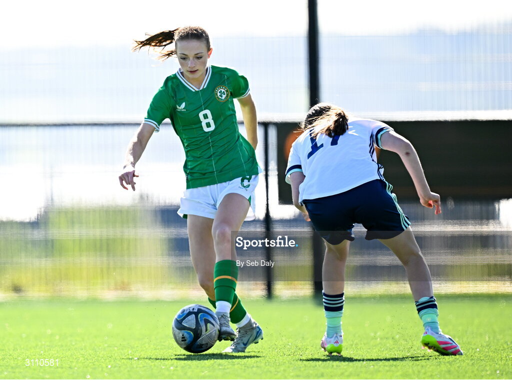 17 April 2025; Ruby Norris of Republic of Ireland in action against Grace Murray of Northern Ireland during the Girls U15 SAFIB Bob Docherty Cup match between Northern Ireland and Republic of Ireland at Greenisland FC in Antrim. Photo by Seb Daly/Sportsfile