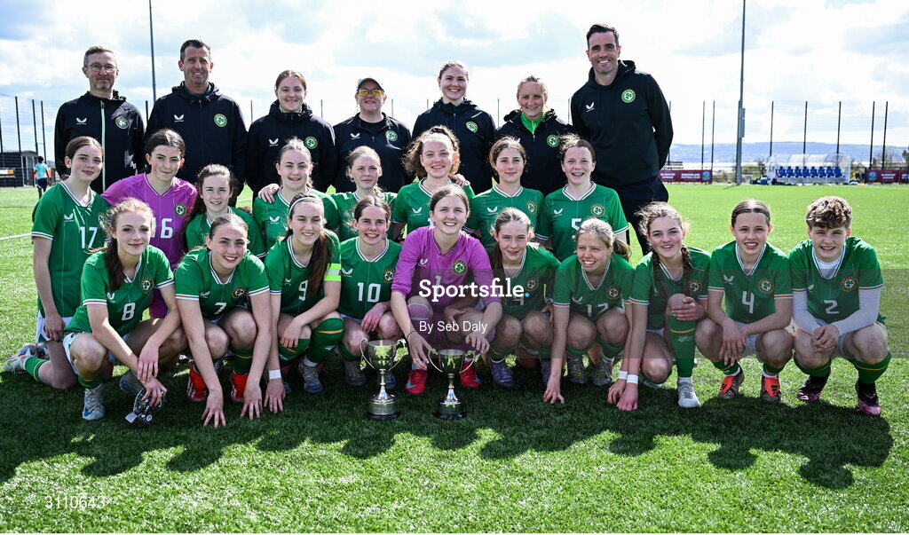 17 April 2025; Republic of Ireland players and coaches celebrate with the Bob Docherty Cup after their side's victory in the Girls U15 SAFIB Bob Docherty Cup match between Northern Ireland and Republic of Ireland at Greenisland FC in Antrim. Photo by Seb Daly/Sportsfile