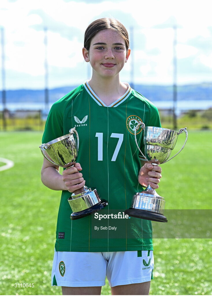 17 April 2025; Kyra Gavigan of Republic of Ireland with the Bob Docherty Cup and the John Read Trophy after the Girls U15 SAFIB Bob Docherty Cup match between Northern Ireland and Republic of Ireland at Greenisland FC in Antrim. Photo by Seb Daly/Sportsfile