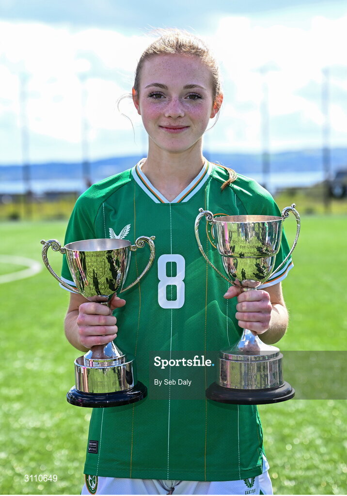 17 April 2025; Ruby Norris of Republic of Ireland with the Bob Docherty Cup and the John Read Trophy after the Girls U15 SAFIB Bob Docherty Cup match between Northern Ireland and Republic of Ireland at Greenisland FC in Antrim. Photo by Seb Daly/Sportsfile