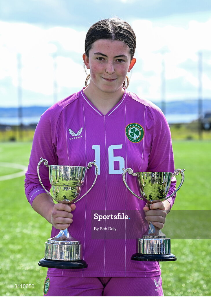 17 April 2025; Republic of Ireland goalkeeper Lucy Doyle Farrington with the Bob Docherty Cup and the John Read Trophy after the Girls U15 SAFIB Bob Docherty Cup match between Northern Ireland and Republic of Ireland at Greenisland FC in Antrim. Photo by Seb Daly/Sportsfile