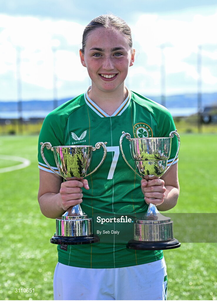17 April 2025; Halle Harcourt of Republic of Ireland with the Bob Docherty Cup and the John Read Trophy after the Girls U15 SAFIB Bob Docherty Cup match between Northern Ireland and Republic of Ireland at Greenisland FC in Antrim. Photo by Seb Daly/Sportsfile