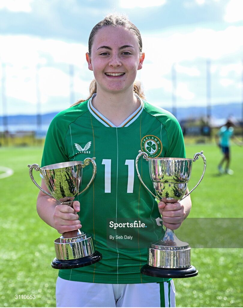 17 April 2025; Abbie Duffy of Republic of Ireland with the Bob Docherty Cup and the John Read Trophy after the Girls U15 SAFIB Bob Docherty Cup match between Northern Ireland and Republic of Ireland at Greenisland FC in Antrim. Photo by Seb Daly/Sportsfile