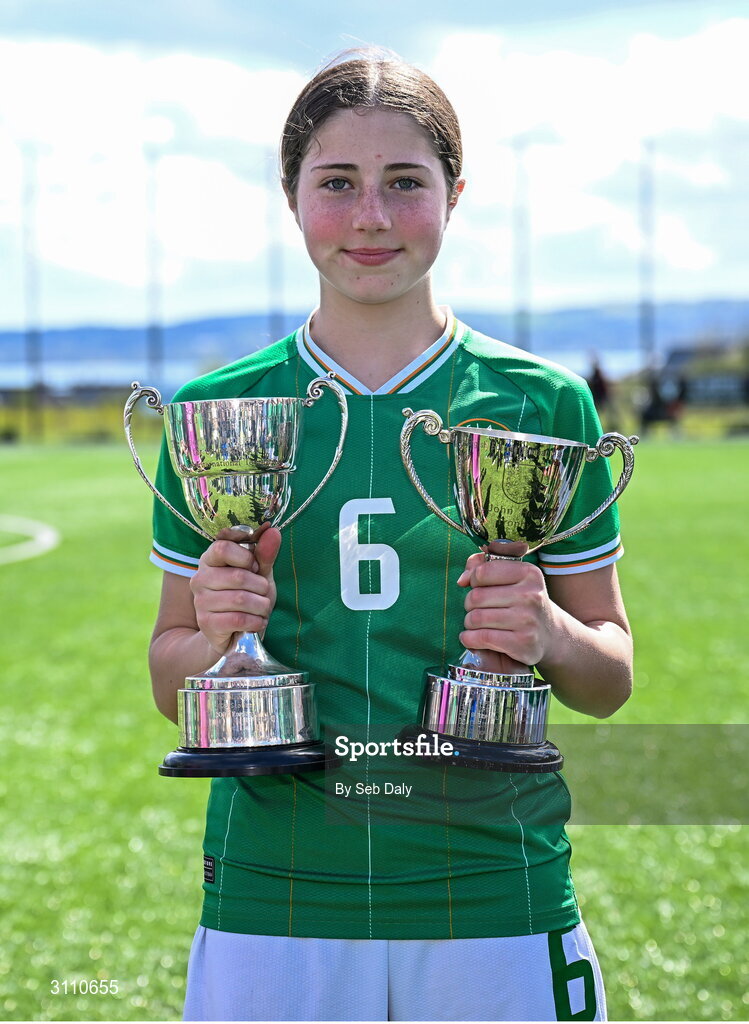 17 April 2025; Lara Dallaghan of Republic of Ireland with the Bob Docherty Cup and the John Read Trophy after the Girls U15 SAFIB Bob Docherty Cup match between Northern Ireland and Republic of Ireland at Greenisland FC in Antrim. Photo by Seb Daly/Sportsfile