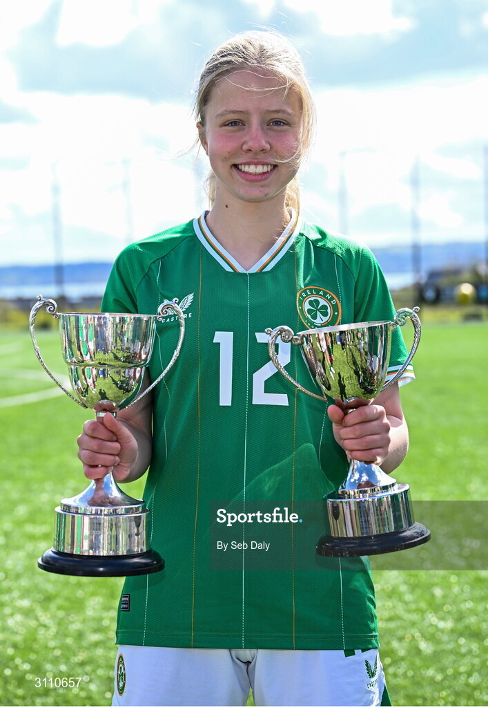 17 April 2025; Matylda Stelmaszek of Republic of Ireland with the Bob Docherty Cup and the John Read Trophy after the Girls U15 SAFIB Bob Docherty Cup match between Northern Ireland and Republic of Ireland at Greenisland FC in Antrim. Photo by Seb Daly/Sportsfile