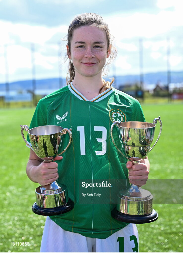 17 April 2025; Maisy Healy of Republic of Ireland with the Bob Docherty Cup and the John Read Trophy after the Girls U15 SAFIB Bob Docherty Cup match between Northern Ireland and Republic of Ireland at Greenisland FC in Antrim. Photo by Seb Daly/Sportsfile