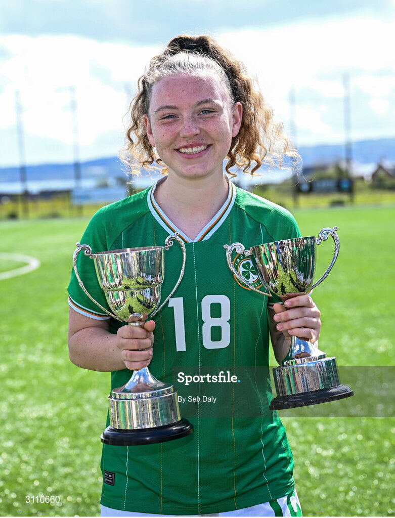17 April 2025; Laila Hurley of Republic of Ireland with the Bob Docherty Cup and the John Read Trophy after the Girls U15 SAFIB Bob Docherty Cup match between Northern Ireland and Republic of Ireland at Greenisland FC in Antrim. Photo by Seb Daly/Sportsfile