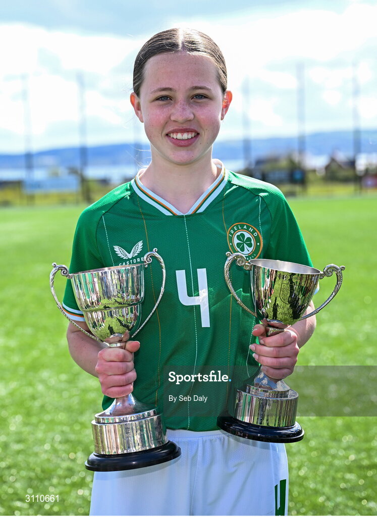 17 April 2025; Skye Barrett of Republic of Ireland with the Bob Docherty Cup and the John Read Trophy after the Girls U15 SAFIB Bob Docherty Cup match between Northern Ireland and Republic of Ireland at Greenisland FC in Antrim. Photo by Seb Daly/Sportsfile