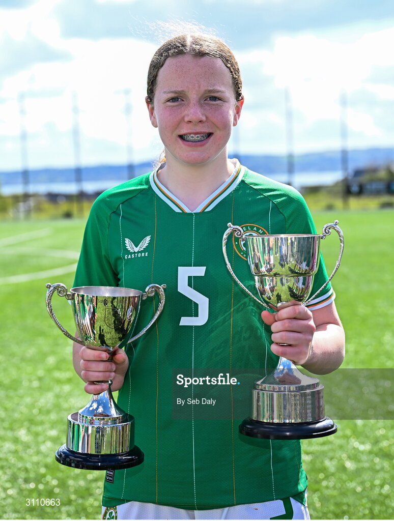 17 April 2025; Ruby Boland of Republic of Ireland with the Bob Docherty Cup and the John Read Trophy after the Girls U15 SAFIB Bob Docherty Cup match between Northern Ireland and Republic of Ireland at Greenisland FC in Antrim. Photo by Seb Daly/Sportsfile